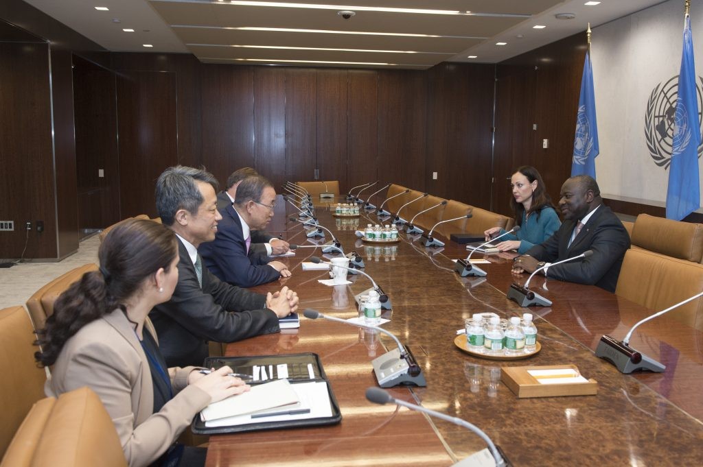 Group of people having a discussion at a table.