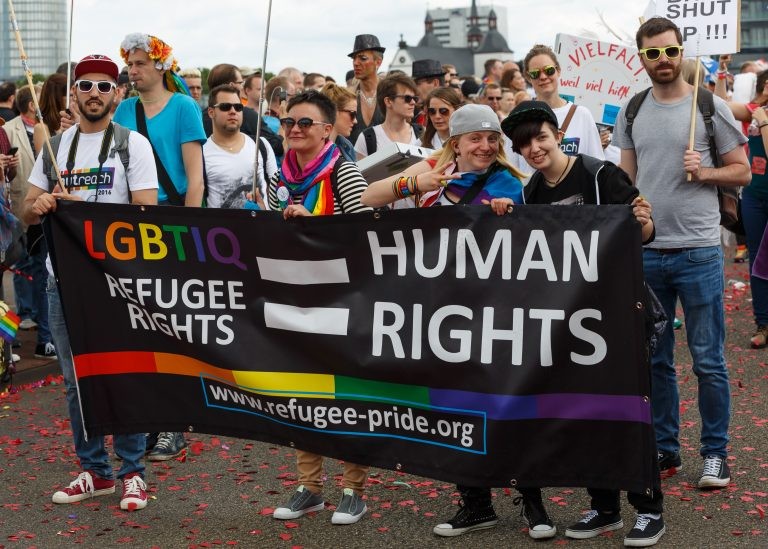 People at a march in support of LGBTIQ+ and Human rights