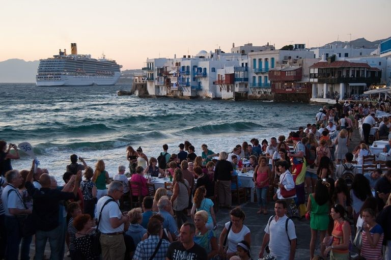 Little Venice quay flooded with tourists. Mykonos island. Cyclades, Agean Sea, Greece