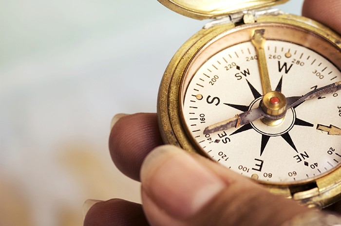 Photo of compass in someone's hand