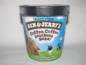 Pint of 'Coffee, Coffee, BuzzBuzzBuzz' icecream by Ben and Jerry's unopened and sitting on a white table.