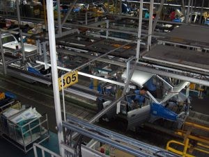 Two workers assempling a car on an assembly line at Hyundai Motor Company's car factory in South Korea.